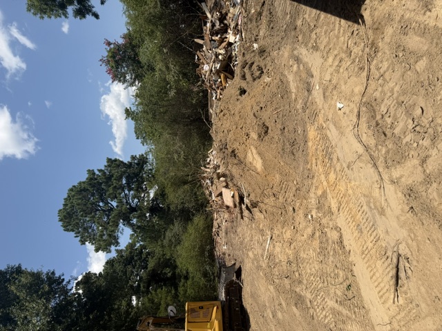 Debris cleanup and grading on a demolition site