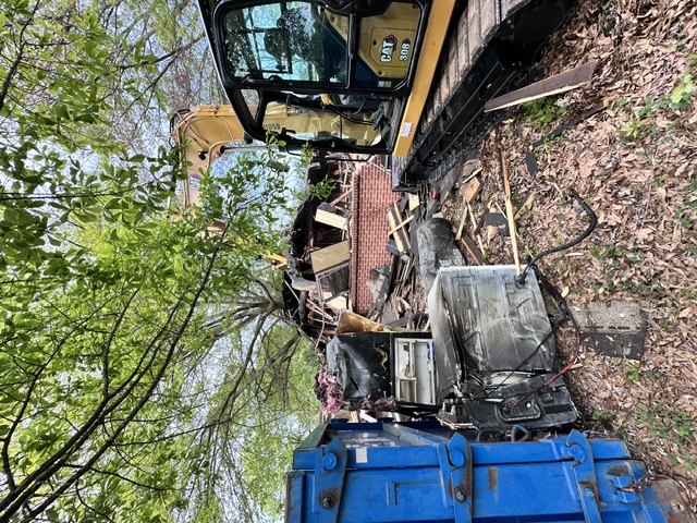 Active demolition of a fire-damaged structure in Arkansas